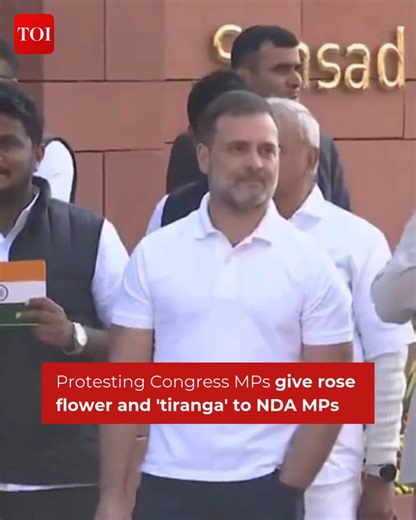 Watch | In a unique protest in #Parliament premises, Congress MPs are giving a rose flower and 'tiranga' to NDA MPs #ParliamentProtests #ParliamentWinterSession | The Times of India