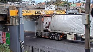 Overheight trucks hitting rail bridges