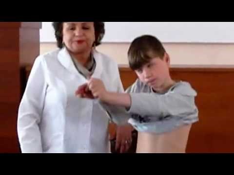 Medical examination of boy presented to a group of college students.
