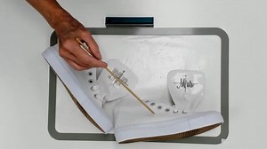 Tuesday Tip! Sticky Hoop lets you embroider hard-to-work with items like zippered cases, shoes, stuffed animals, and more. Watch Eileen show how easy it is to hoop a pair of sneakers to embroider on the tongue. #TuedayTip #embroiderytips #embroideryhoops | DIME by OESD