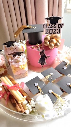 29 reactions | Happy Graduation-Dessert Platter‍壟✨ Filled with graduation themed vanilla buttercream cake with lotus biscoff accompanied with lotus and vanilla chocolate mousse dessert cups, imported chocolate and vanilla wafers wrapped in ribbons and Ferrero rochers✨‍ . . . #dessertplatter #graduation #happygraduation #classof2023 #dessertsofinstagram #homemade #eventiveofficial #eventivelahore #dessertplattersbyeventive | Eventive-Embellishing Events | Facebook