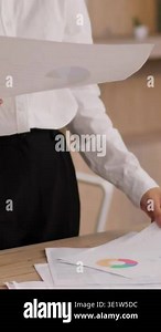 Asian Japanese business woman office employer analyzing documents graph chart professional businesswoman female girl Korean Chinese worker secretary manager analyst paperwork report project indoors Stock Video Footage - Alamy