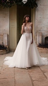 This stunning #NicoleMilano 'Raelyn' mermaid wedding dress is crafted in sequinned tulle with a semi-sheer V-neck bodice adorned with sparkly beads allover with a removable tulle overskirt. https://bit.ly/3wx7mUX __________________ Appointment Only https://designerbridalroom.com.my/appointment WhatsApp: +60 13-622 7573 | Designer Bridal Room, Malaysia | Facebook