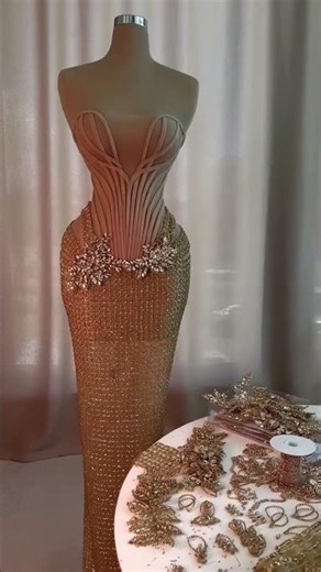 To order this nude dress DM reineecouture A sculptural strapless corset gown in a soft nude tone,