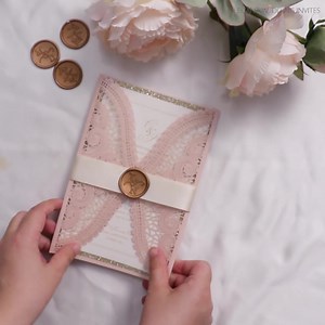 Blush Lace Laser Cut Wedding Invites with Ribbon & Wax Seal Let your love story unfold in style with these beautifully crafted invitations. #elegantweddinginvitation #lasercutinvitations #weddingplanner #WeddingInvitations #WeddingStationery #lasercutweddinginvitations #WeddingInvites | ElegantWeddingInvites | Facebook