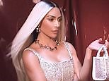 Kim Kardashian flaunts her platinum blonde locks while modeling for Marc Jacobs