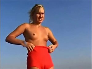 Blonde beach photoshoot - watch on VoyeurHit.com. The world of free voyeur video, spy video and hidden cameras