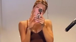 Khloe puts pin-thin arms & muscular legs on display while lifting 100lb weights