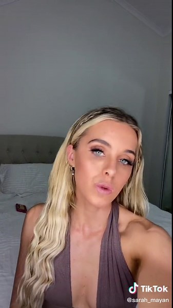 Stylish Bedroom Poses: Woman with Long Blonde Hair