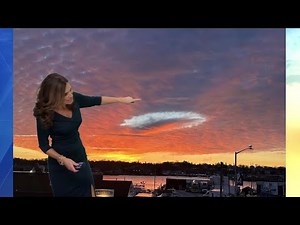 What causes the 'hole punch cloud' seen over Massachusetts on Tuesday?