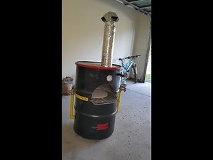 Wood fired mini pizza oven using a 55 gallon drum