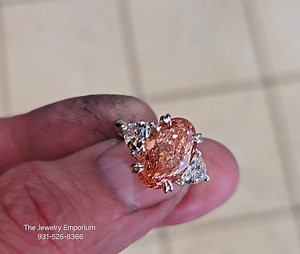 1.4K views · 50 reactions | Dirty fingers holding an amazing ring! Lab grown pink diamond with triangle shaped sides in white gold. Stunning!!!! #cookevillerocks #getmyring www.GetMyRing.com | The Jewelry Emporium | Facebook