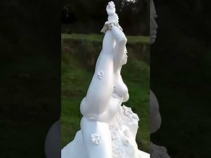Art beautiful plaster statue in garden