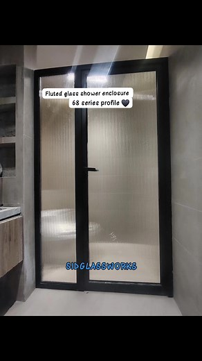 Fluted glass shower enclosure Fluted glass with vertical or horizontal grooves, offering both privacy and light transmission, | Sid Glass Works