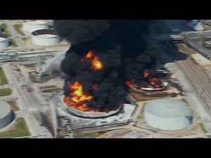 Fire at oil refinery sends up tower of black smoke