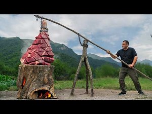 Slow-Cooked Beef Leg Inside a Smoldering Log Over Fire