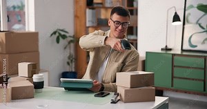 Tablet, scan and box with man in warehouse for dropshipping, inventory and barcode checklist. Logistics, qr code inspection and ecommerce seller with person in factory for delivery order and pricing Stock Video