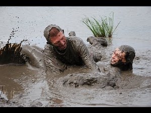 Cute couple plays in the mud