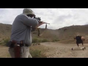 Knocking over the charging cape buffalo