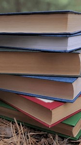 clip-3459675953-stacked-books-forest-concept-learning-reading-knowledge