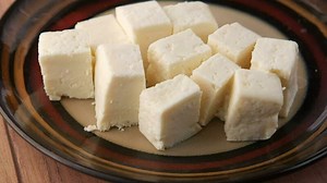 Close up of fresh cheese on white background