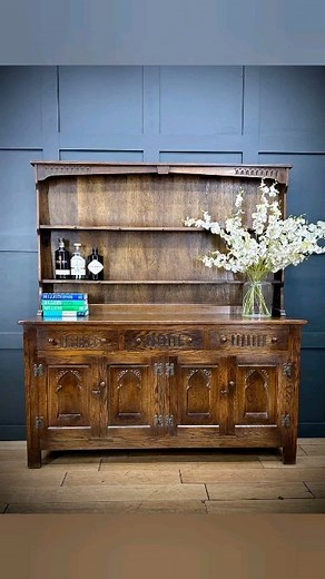 Vintage Oak Welsh Dresser / Large Kitchen Cupboard / Kitchen Display Dresser £475 Vintage oak dresser. Tudor style. Display top with wooden hooks. Base is made up of three drawers above two double shelved cupboards, offering plenty of storage. The top comes off for ease of delivery. Condition report. In used condition. Showing previous signs of light use. The odd scuff and scrape. Dimensions are approx; Length 152cm Width 43cm Height 168cm #Dresser #vintagedresser #farmhousestyle #kitchendresser