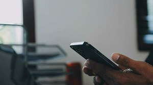 Download attractive business asian man working with computer laptop on wooden table at home. analyzing online data to success business