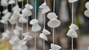 Moving of Seashells Mobile Hanging with Light Wind Blowing on the Beach. Beautiful Handicrafts Produced by Sea Shell Stock Video - Video of ceiling, decorate: 239211389