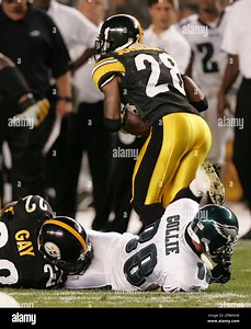 Pittsburgh Steelers cornerback William Gay, left, striped the ball from Philadelphia Eagles wide receiver Zac Collie, bottom, forcing a fumble as Jovon Johnson, top, recovered the ball and took it 80 yards for a touchdown, sealing Pittsburgh's 27-13 win in the fourth quarter of the preseason football game in Pittsburgh, Sunday, Aug. 26, 2007. Steelers' (AP Photo/Keith Srakocic Stock Photo - Alamy