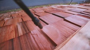 clip-9807734-spraying-treatment-chemicals-on-cedar-roof-shingles