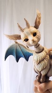 Who could resist “Star-traversing dragon" by @2mikaduki? Not us! "The little dragon that travels among the stars, when weary from its long journey, comes to me on a whim. It rests slowly, seeking comfort, and devours a hearty meal, then quietly begins to groom its wings." #beautifulbizarre #surrealart #cuteart #sculpture #contemporaryart #artlovers #puppet #marionette #woodsculpture #fantasydoll #dollartist #artdoll | Beautiful Bizarre Magazine