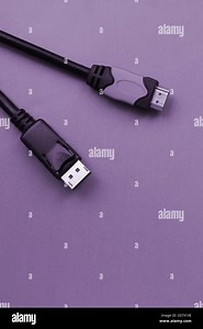Audio video HDMI computer cable plug and 20-pin male DisplayPort gold plated connector for a flawless connection on a purple background Stock Photo - Alamy