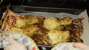 Video of homemade crispy roasted chicken legs on the pan