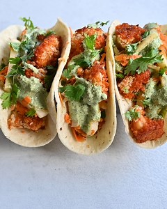 RECIPE: https://rainbowplantlife.com/crispy-spicy-cauliflower-tacos-with-jicama-carrot-slaw/ These Crispy Spicy Vegan Cauliflower Tacos are so flavorful that no one will miss the meat! Made with crispy baked cauliflower coated in a buttery hot sauce, a cooling jicama-carrot slaw, and a delicious cilantro crema. Vegan, nut-free, soy-free, and easy to make gluten-free. | Rainbow Plant Life