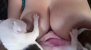 Women breastfeeding two puppys