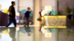 Hotel Lobby with Employees and Guests Blur background.
