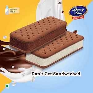 A mouthful bite of Vanilla and Chocolate Ice Cream Sandwich from Dairy Day. #DairyDay #Summers #IceCream #Delicious | Dairy Day Ice Cream | Facebook