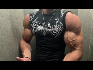 19 year old teen boy flexing muscle