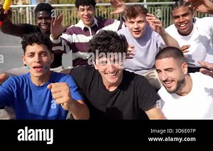 Happy group of excited multiracial male friends cheering for their favorite team at the stadium, celebrating a goal together with enthusiasm and passion while looking at the camera Stock Video Footage - Alamy