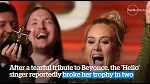 Adele breaks Grammy award in two