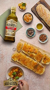 PANE CUNZATO - SICILIAN SEASONED BREAD One of the greatest secrets to Italian cuisine is simplicity.'Pane cunzato' is a recipe from the Sicilian countryside, where high quality ingredients endow simple recipes with a symphony of flavours. With its robust and fruity aromas, Filippo Berio Fruttato Extra Virgin Olive Oil will perfectly complement the salty flavour of anchovies and the subtle sweetness of tomatoes. Ingredients (makes 6 - 8 portions): - 400 g of durum wheat bread - 350 g of yellow to