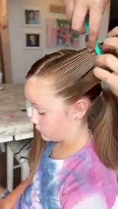 This fun and unique girls hairstyle incorporates connected ponytails, a 3 strand braid and low pigtails! | Easy Toddler Hairstyles