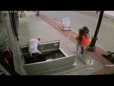 Woman Distracted By Phone Falls Into Sidewalk Hole