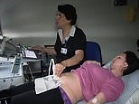 NHS demonstration of an ultrasound being carried out on a pregnant woman