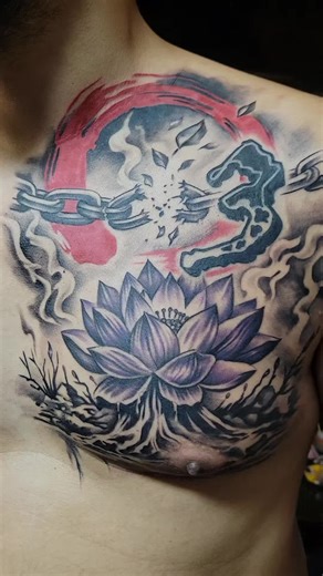lotus flower, breaking chains. the 3 is part of a 13 tattoo he already had on each shoulder. I re-did those. #lotus #breakingchainstattoo #chesttattoo #tattoo #lotusflower
