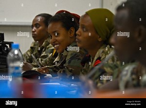 Djibouti Armed Forces (FAD) personnel review photographic composition techniques during a weeklong training session Dec. 2, 2015, at Camp Lemonnier, Djibouti. The Combined Joint Task Force-Horn of Africa Public Affairs Office provided instruction on framing, exposure, focus, and camera operation. Participants practiced capturing still and video imagery for operational documentation and public affairs. The program aimed to enhance technical skills, professional knowledge, and cross-military colla