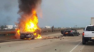 Man arrested after abandoning stolen car on spillway, causing crash, fire