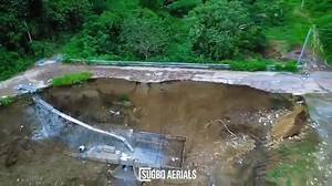 27K views · 163 reactions | LOOK: A section of the road in Barangay Guba, Cebu City has experienced major soil erosion, causing damage to the pavement and posing risks to motorists and residents. The area remains hazardous to motorists and residents as the ground may continue to collapse following days of heavy rainfall.  Contributed by Sugbo Aerials | Proud Bisaya Bai | Facebook