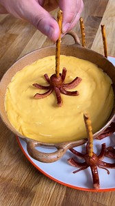 These mini hot dog octopus bites, served with a cheese fondue are the perfect underwater themed party snack! 🐙 #partyfood #easysnacks #snackideas | Twisted