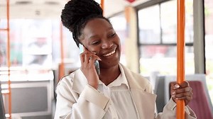 clip-3478677963-happy-woman-telephoning-while-riding-bus